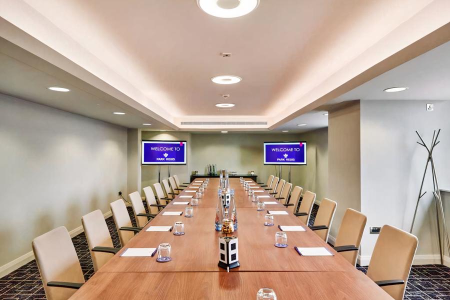 Sycamore Room at The Hub: polished table, ideal for professional meetings and events.
