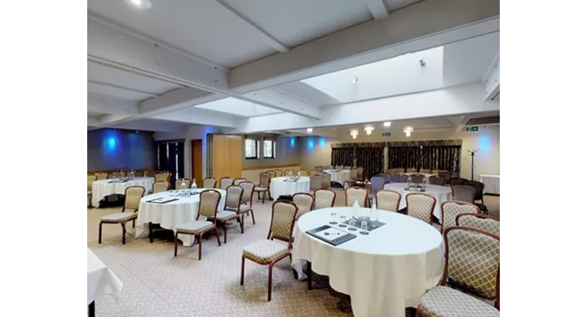 Versatile meeting room with round tables at Lea Marston Hotel for events and gatherings.