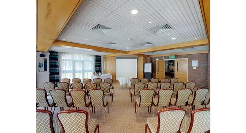 Meeting room at Lea Marston Hotel with elegant chairs for presentations and workshops.