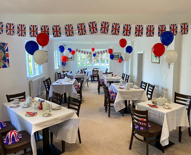 Bournville Social Club function room, decorated for a British-themed event with festive accents.