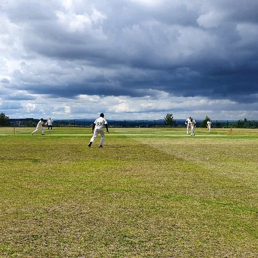 Cricket match at Coombs Wood Sports & Social Club, ideal for team-building events.