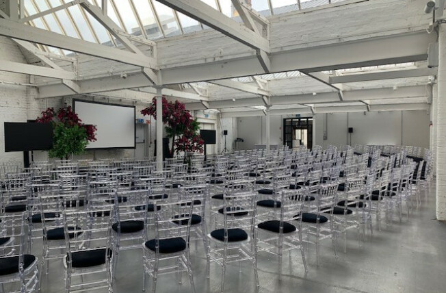 Spacious Factory Works venue with acrylic chairs for conferences and presentations.