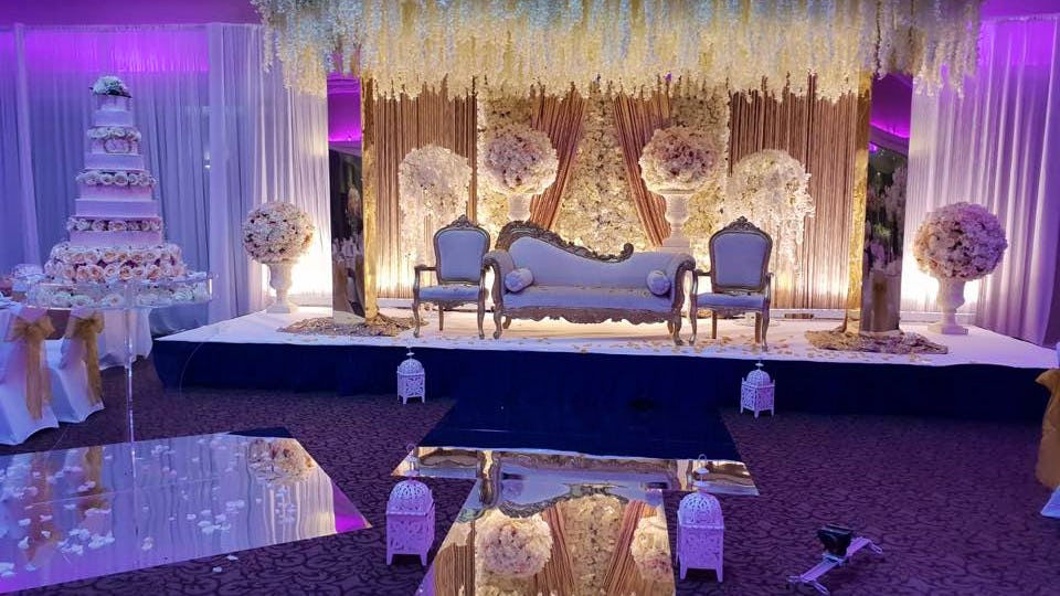 Elegant banquet hall with floral decor, perfect for weddings and upscale events.