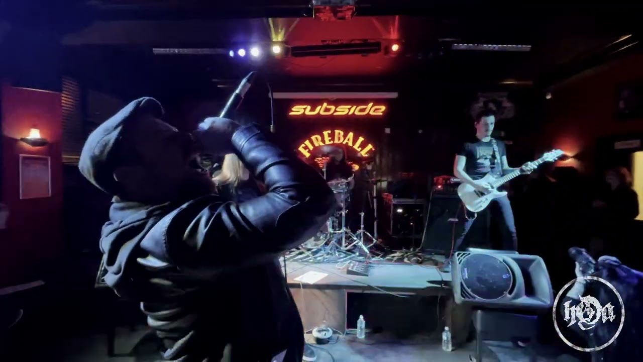 Vibrant live music performance at Subside Bar with dynamic band and engaging atmosphere.