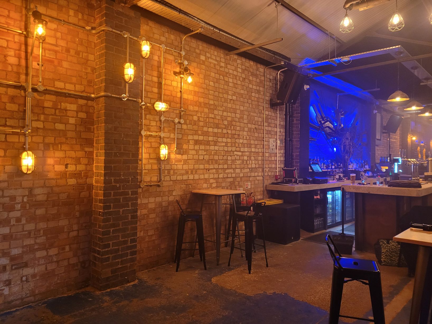 Atarka venue with exposed brick, ideal for events and gatherings.