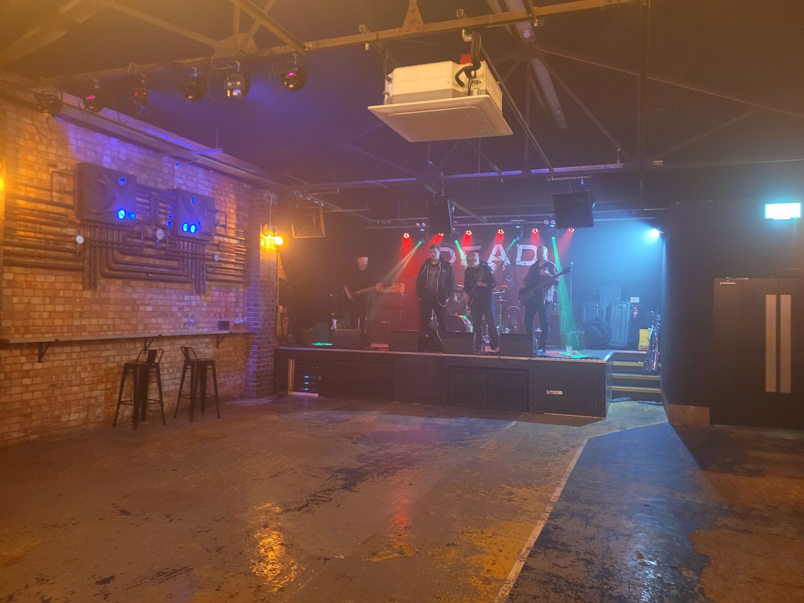 Atarka venue with stage lighting, perfect for concerts and corporate events.