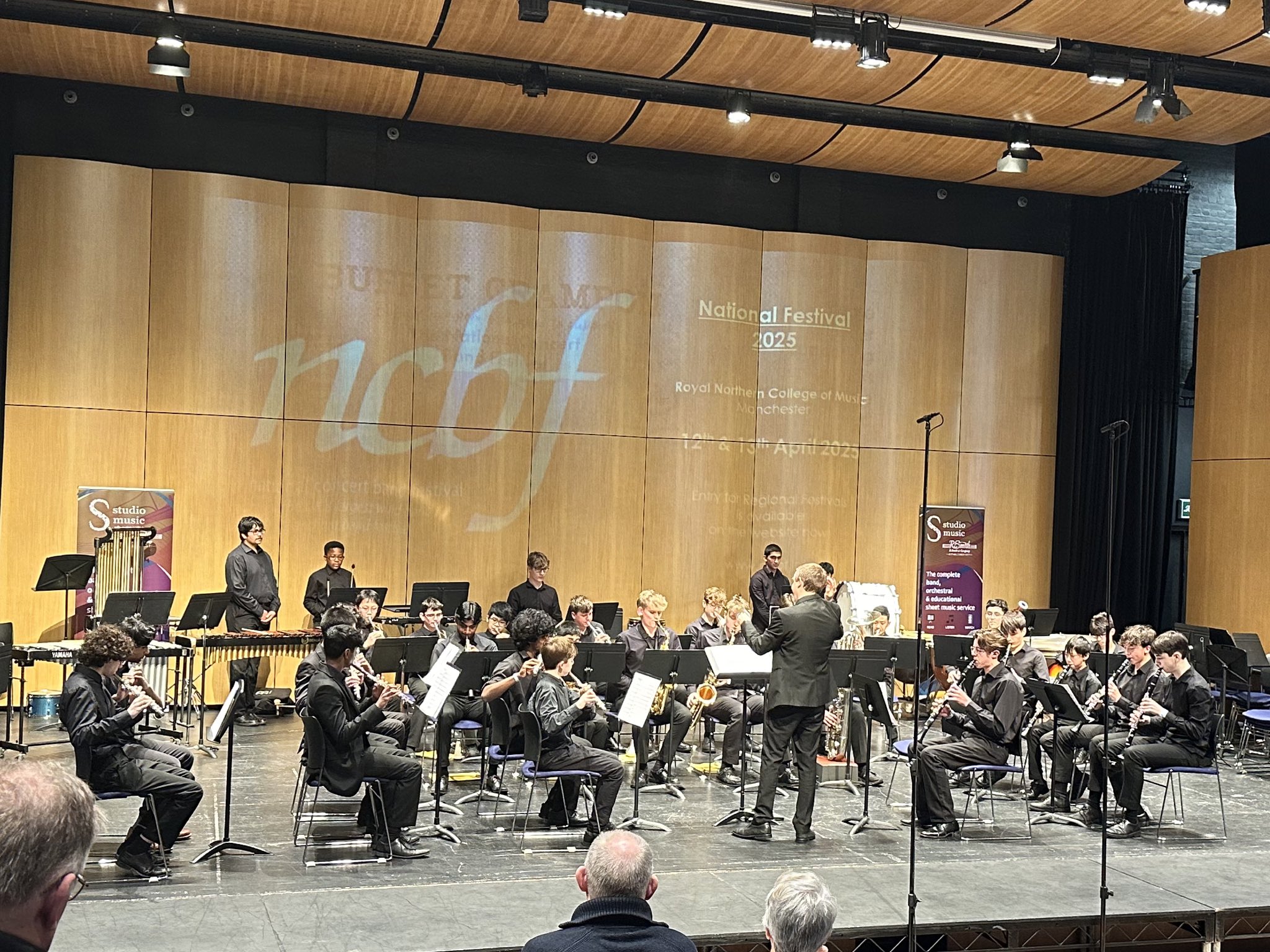 Youth orchestra performance at National Concert Band Festival, showcasing stage layout and acoustics.