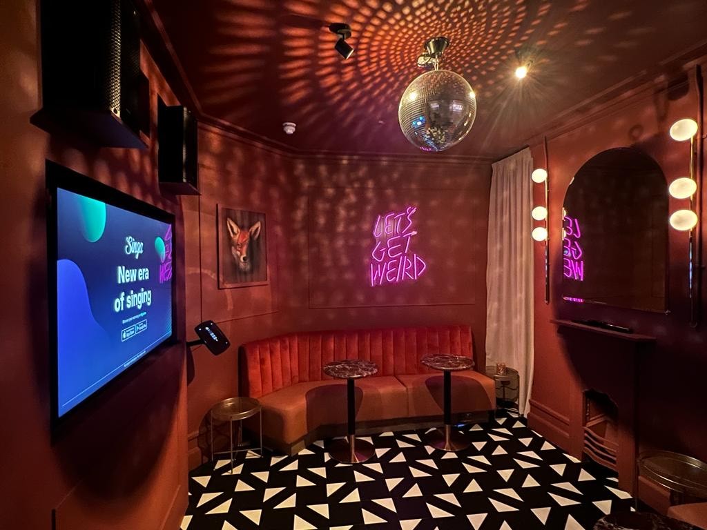 KTV Room at Phoenix Live Music Bar with bold decor for events and gatherings.