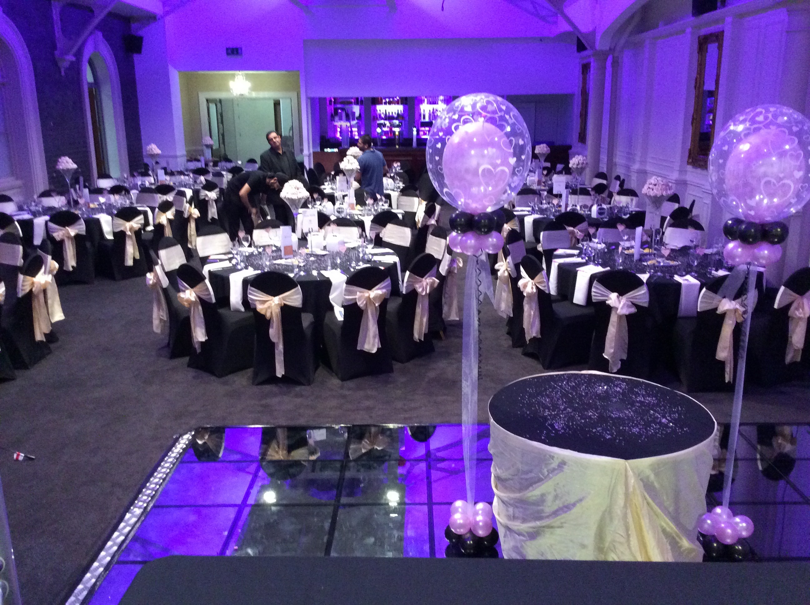 Brunel Suite event space with elegant black and white tables, perfect for celebrations.