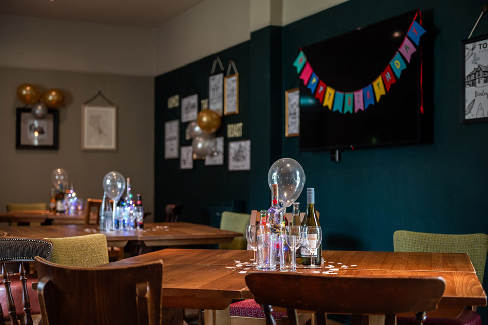 Function room at Hall Green Stadium, elegantly decorated for intimate gatherings and events.