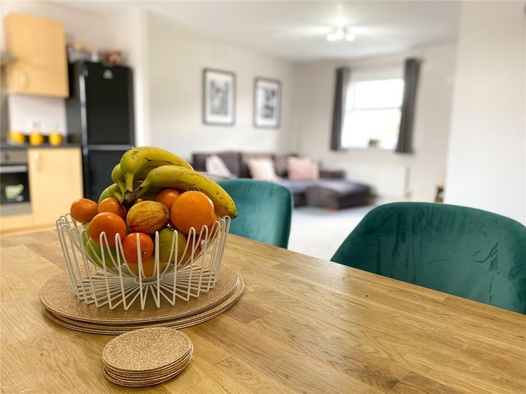 Cozy Evening Room at Brandwood Centre with fruit centerpiece for informal meetings.