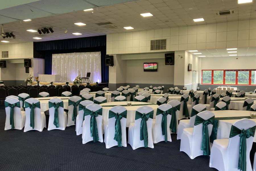 Albert McPherson Lounge event space with teal sashes, ideal for weddings and corporate events.