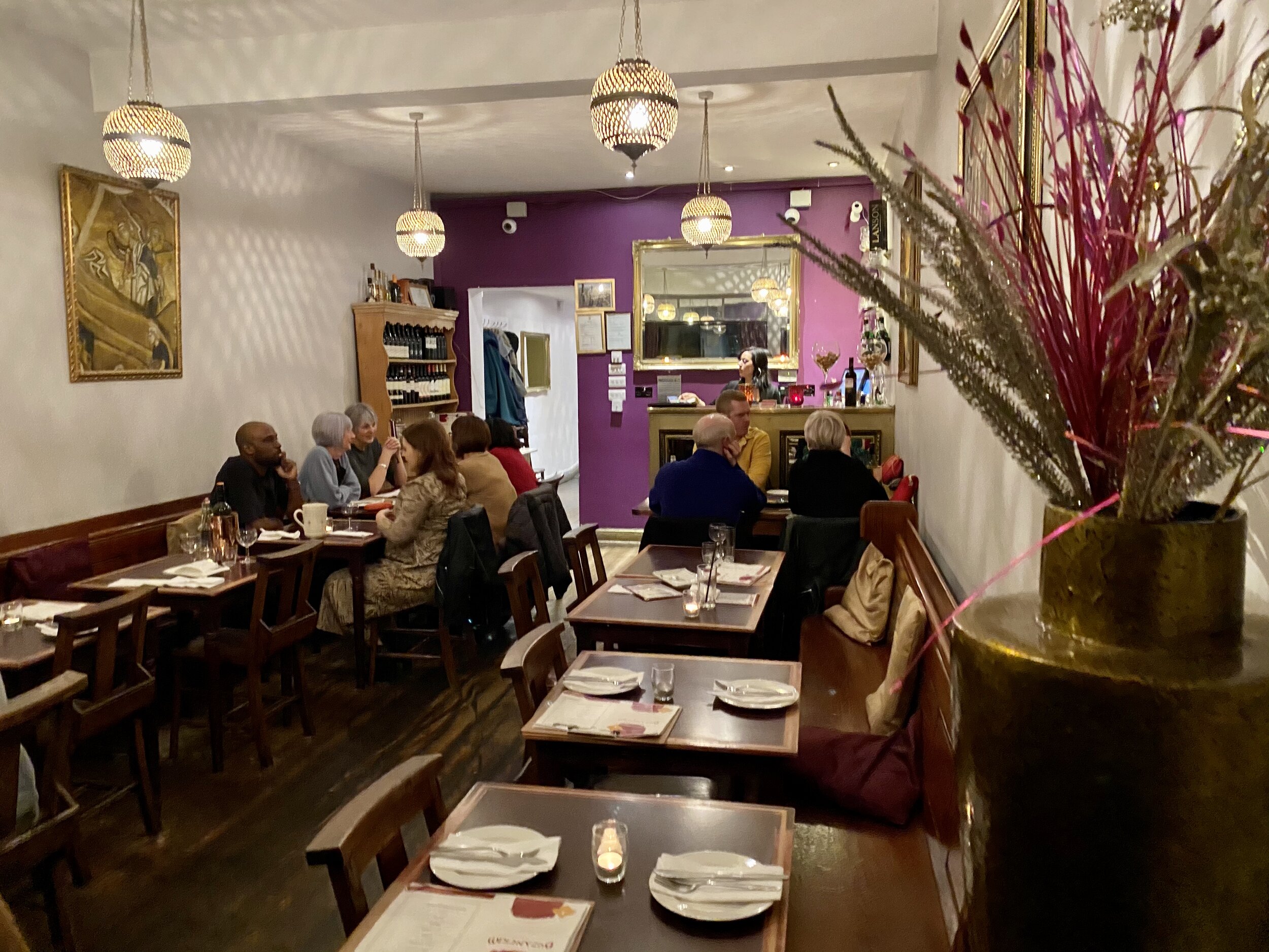 Cozy Byzantium Tapas restaurant with warm lighting, ideal for intimate gatherings and events.