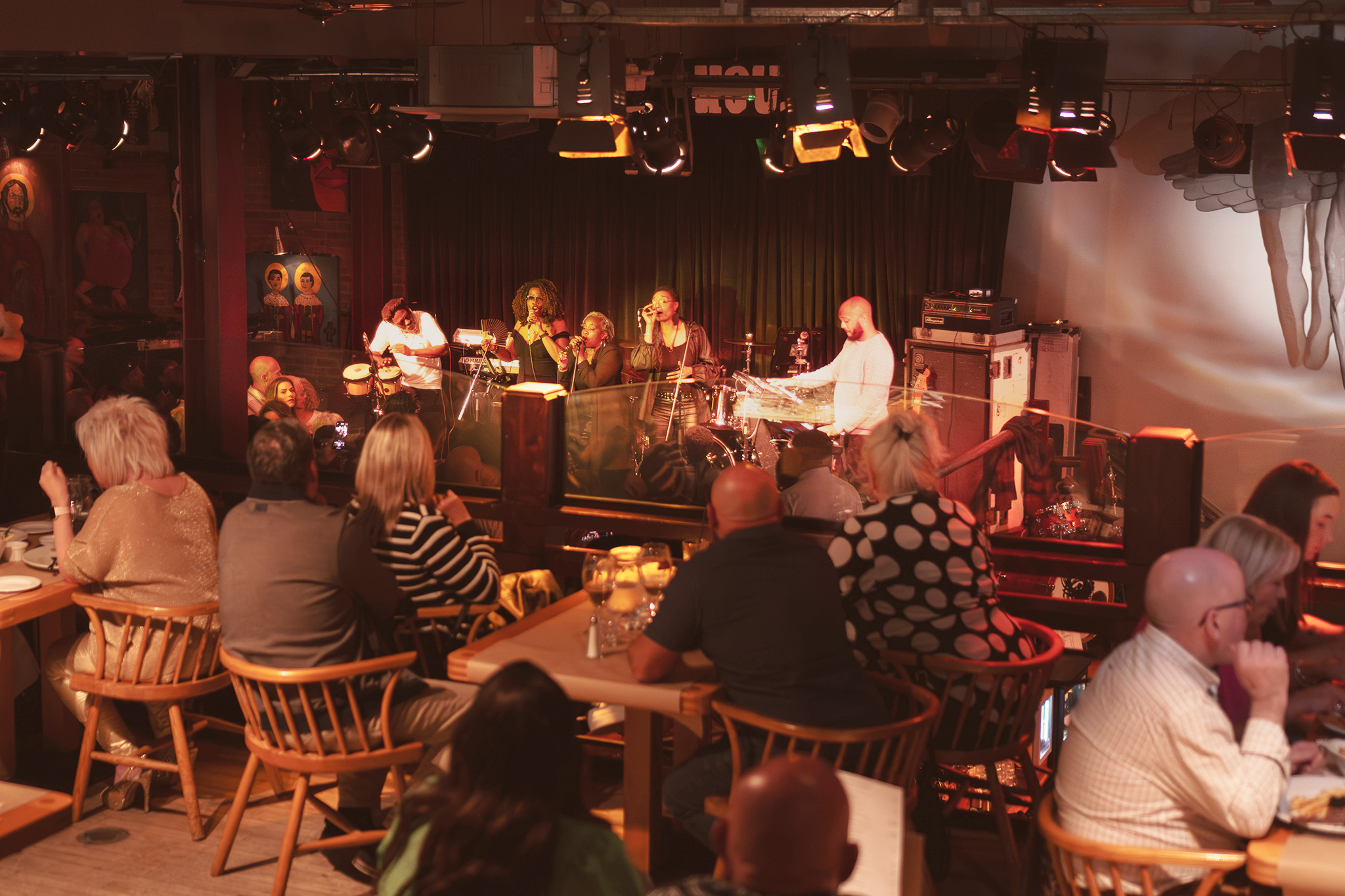 Vibrant live music event on a cozy balcony at The Jam House, perfect for gatherings.