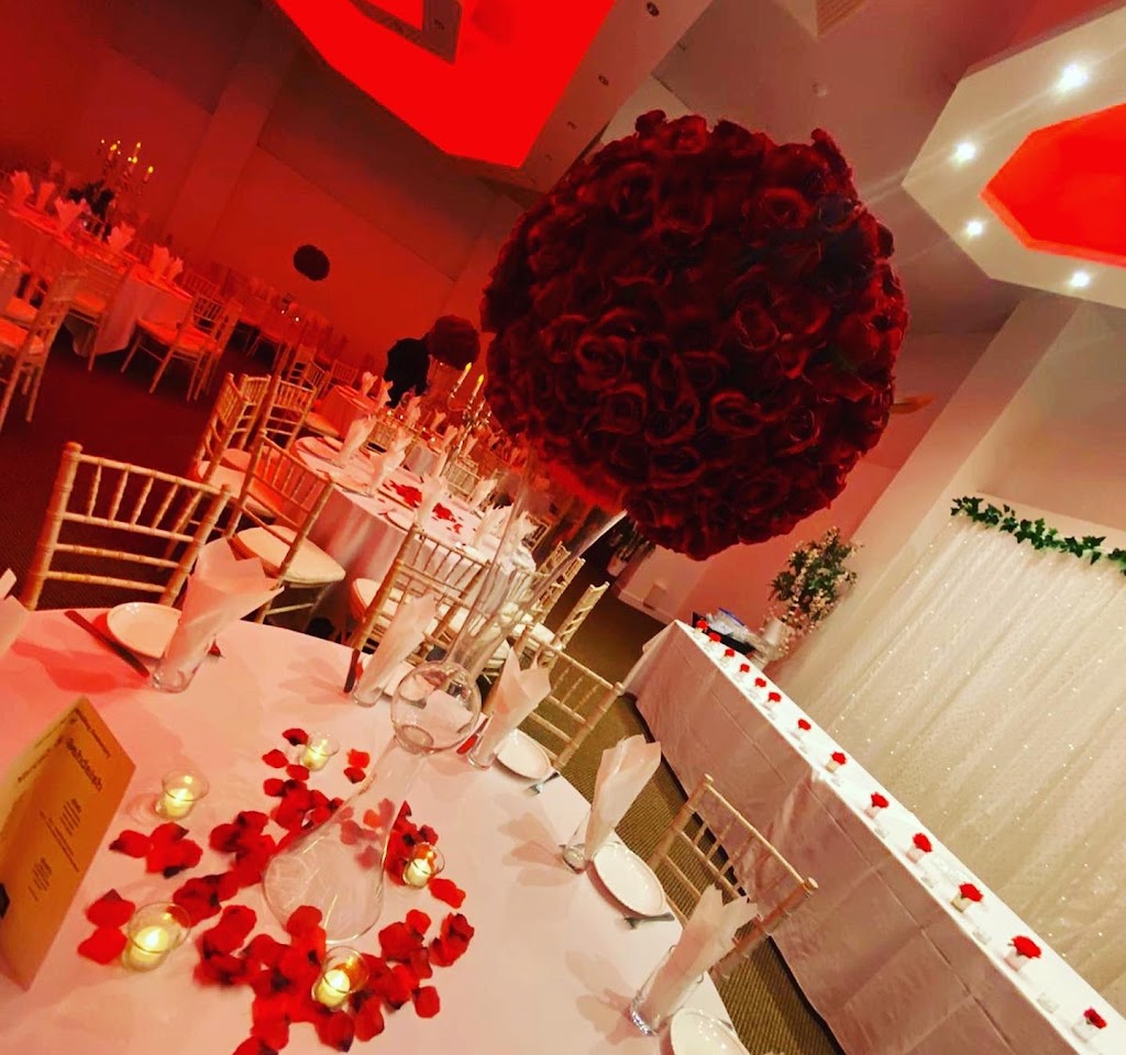 Elegant banquet space with red roses, perfect for weddings and anniversaries.