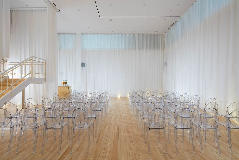 Modern event space in Sanderson London with clear acrylic chairs for corporate meetings.