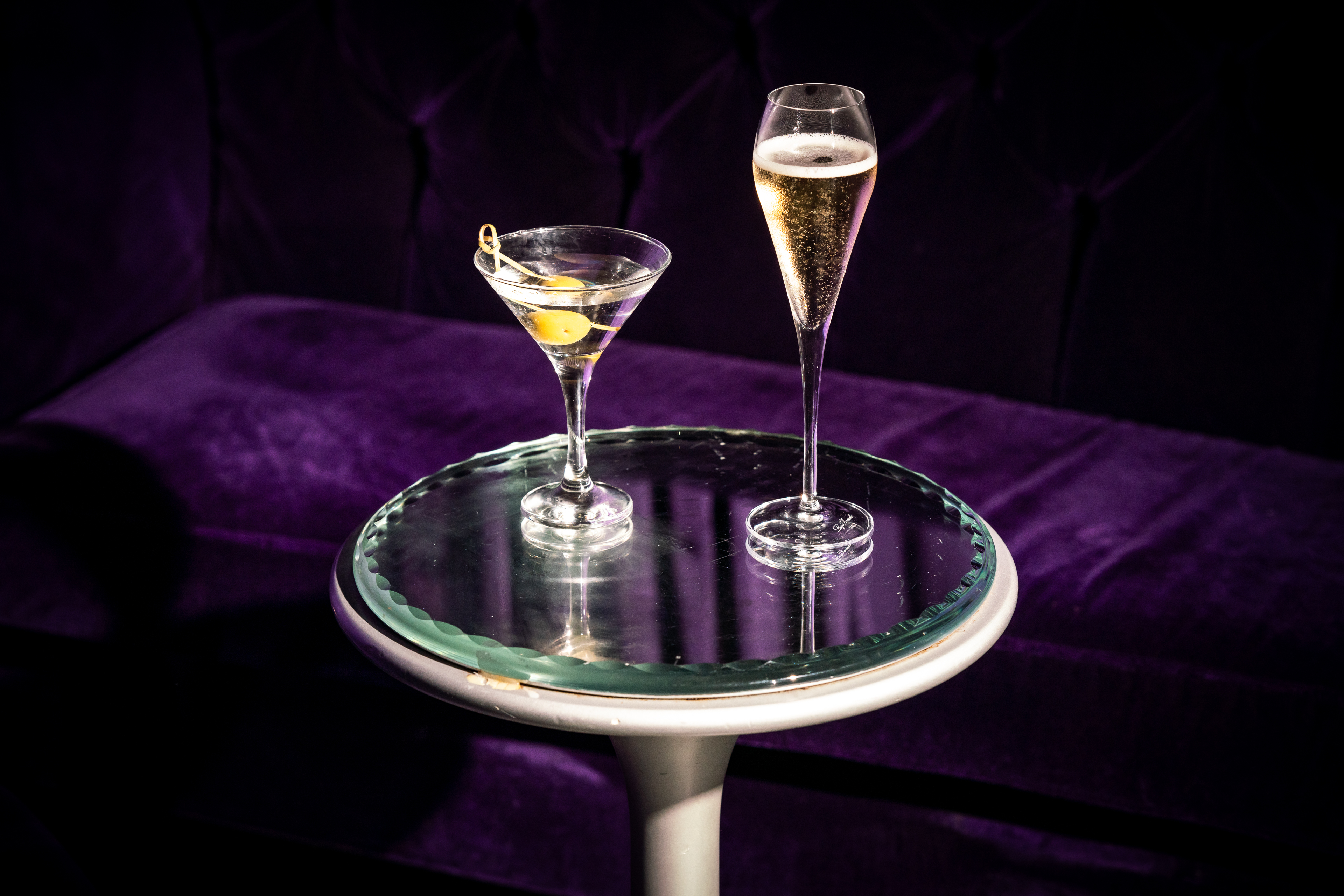 Stylish Purple Bar in Sanderson London with martini and champagne for upscale events.