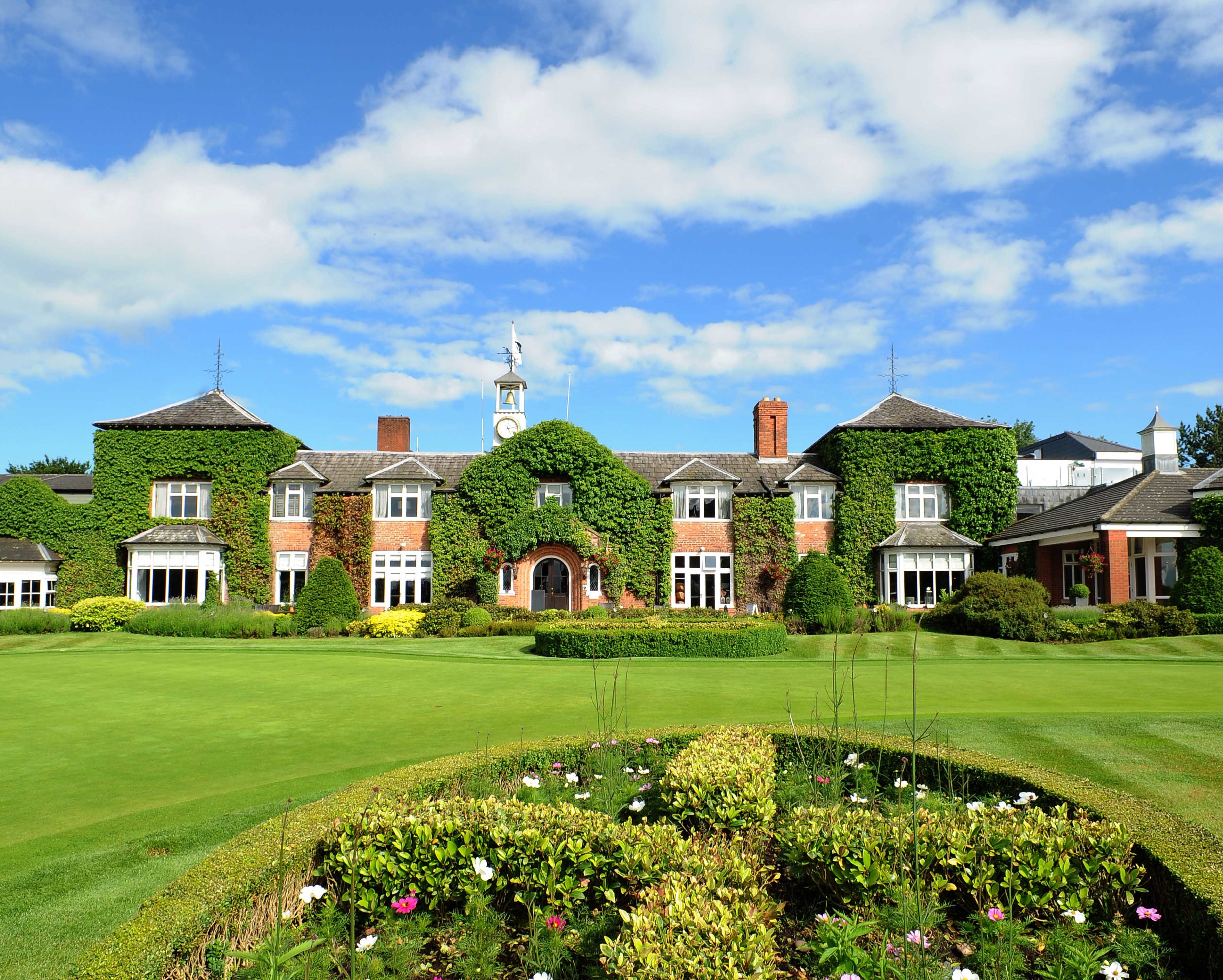 The Ryder Room at The Belfry: elegant venue with lush greenery for corporate events.