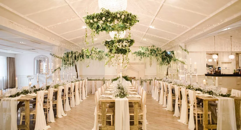 Manor Arches event space with elegant tables, ideal for weddings and gatherings.