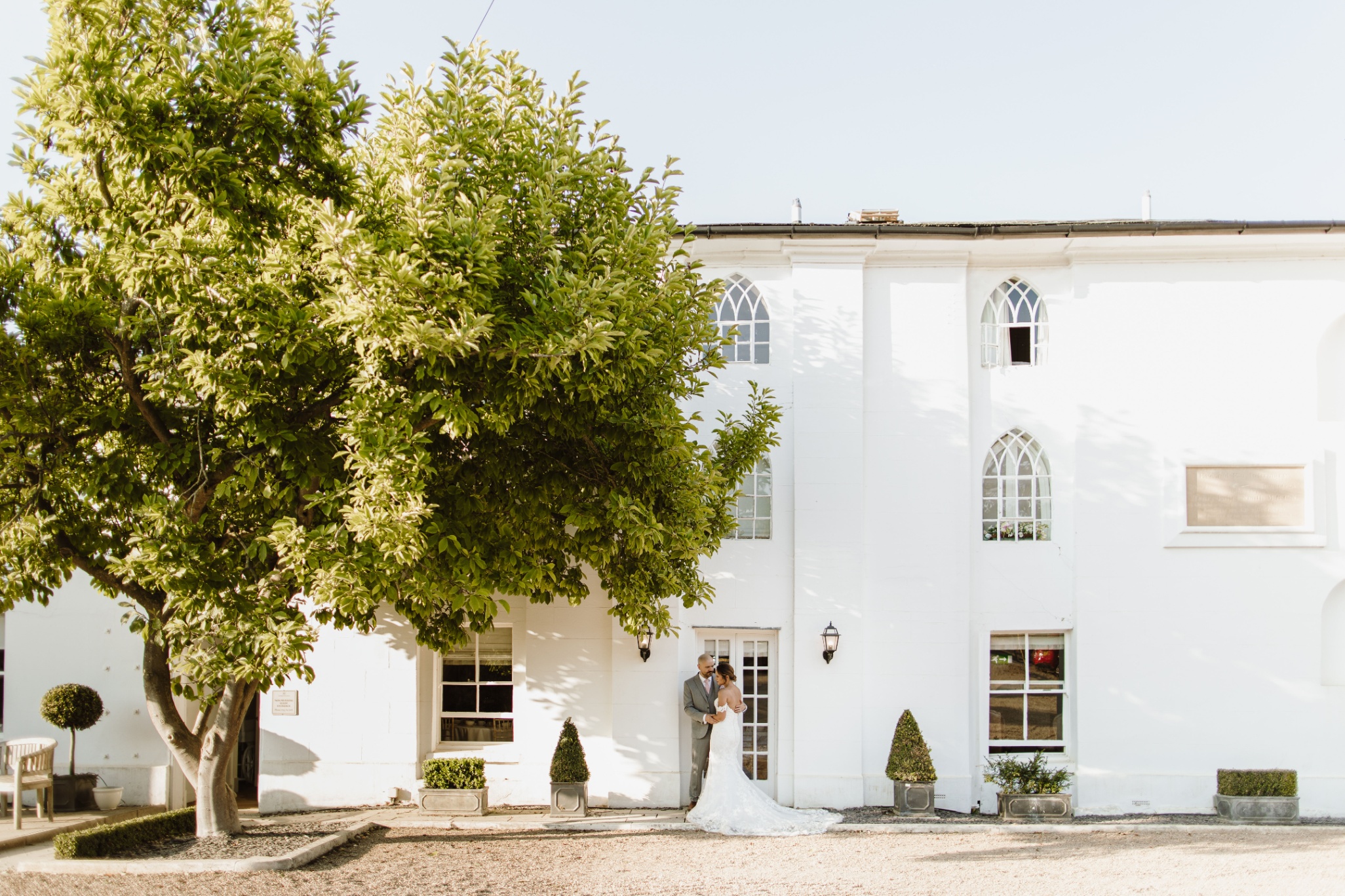 Outdoor gazebo at Warwick House, ideal for weddings and events with lush landscaping.