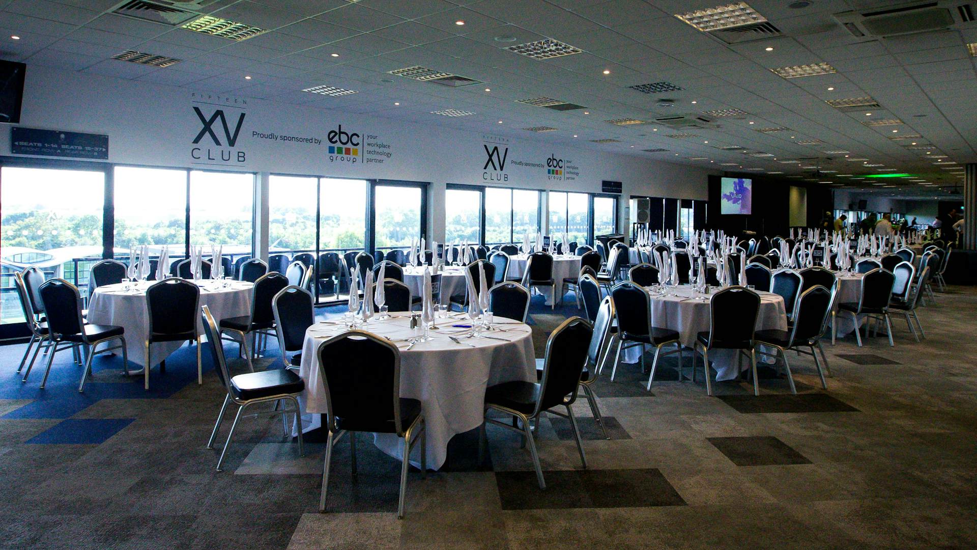 Gala Dinner Hall at Sixways Stadium with elegant round tables for corporate events.