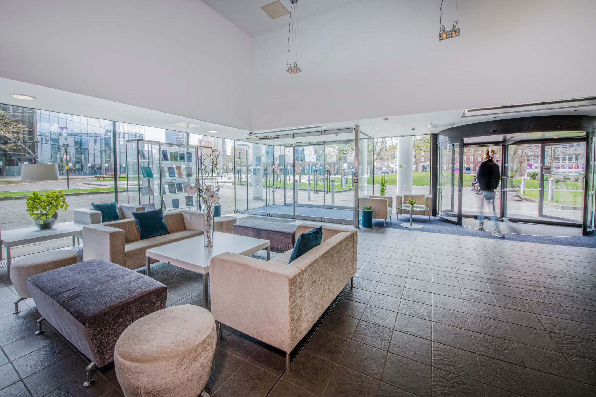 Modern business center lobby with bright windows, ideal for meetings and events.