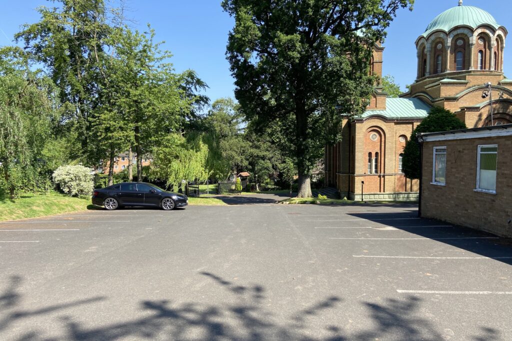 Spacious parking area at Saint Lazar's Hall, perfect for outdoor events and retreats.
