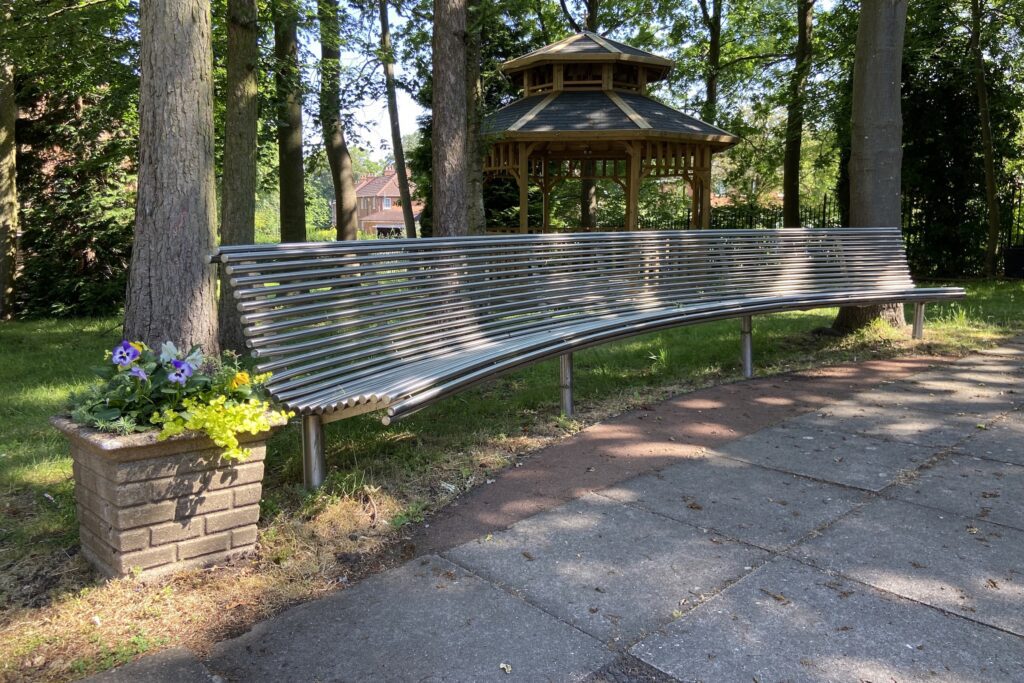 Curved metal bench in Saint Lazar's Hall for outdoor meetings and networking events.