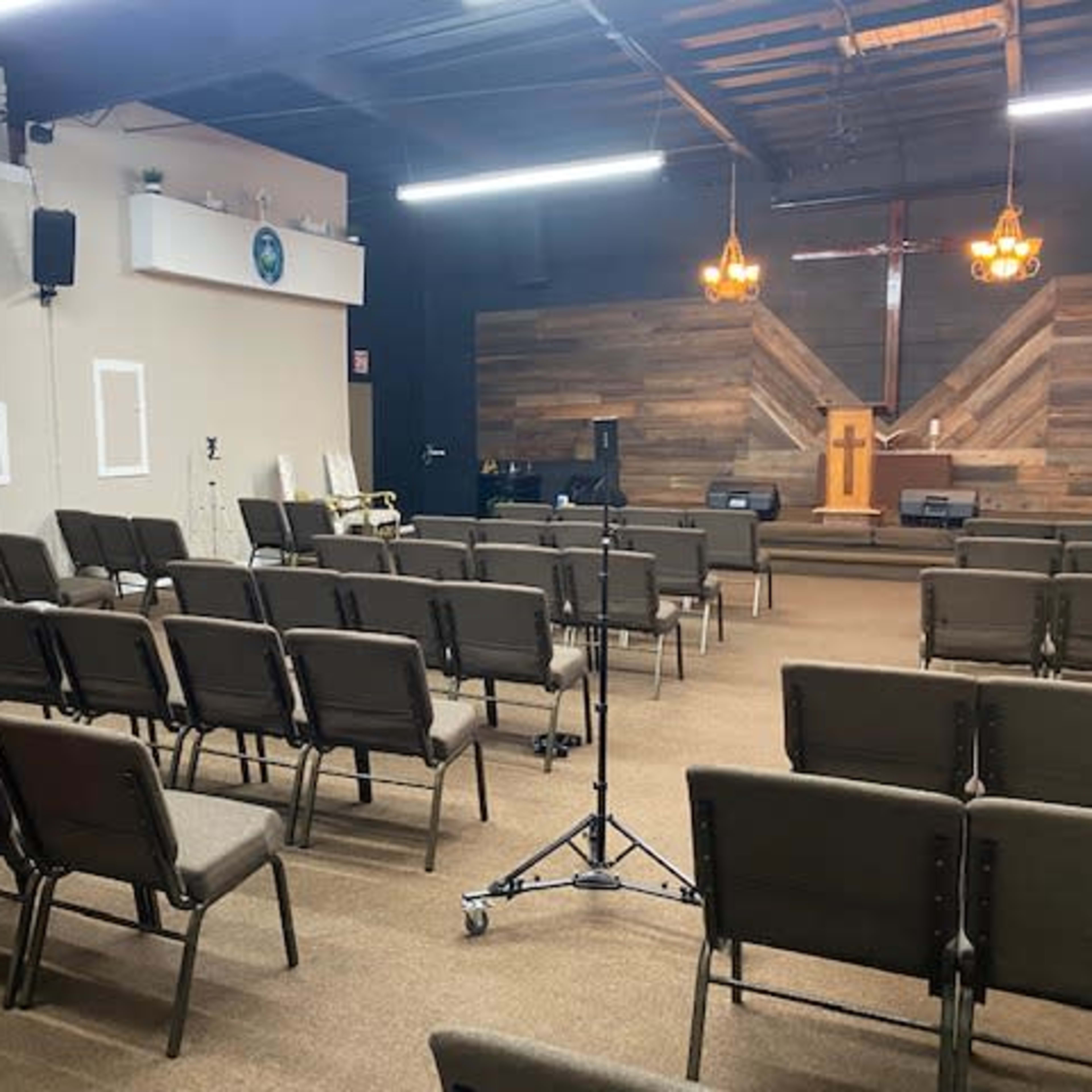 Versatile event space with wooden accents for meetings and community gatherings.