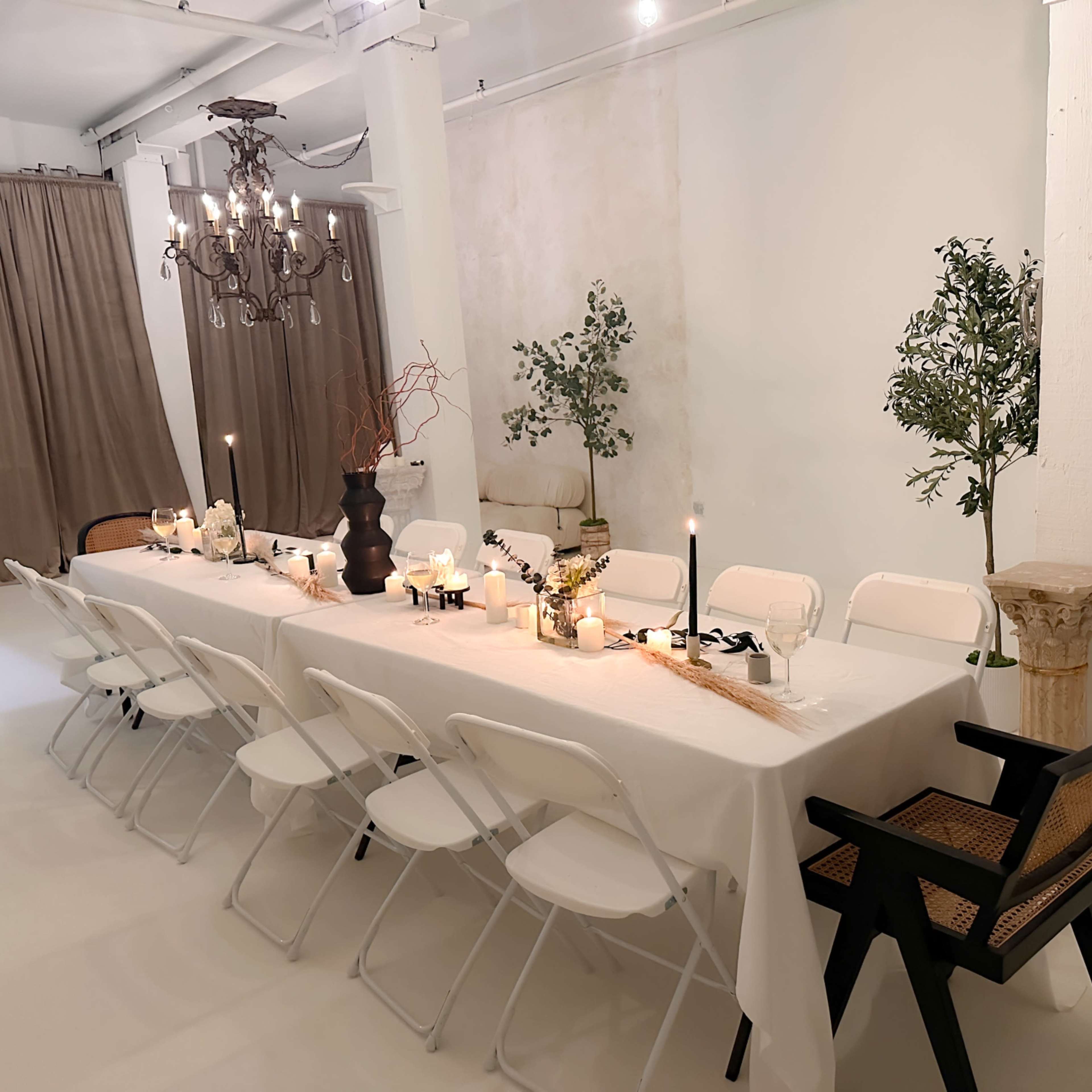 Elegant event space with long table, ideal for intimate gatherings and upscale dinners.