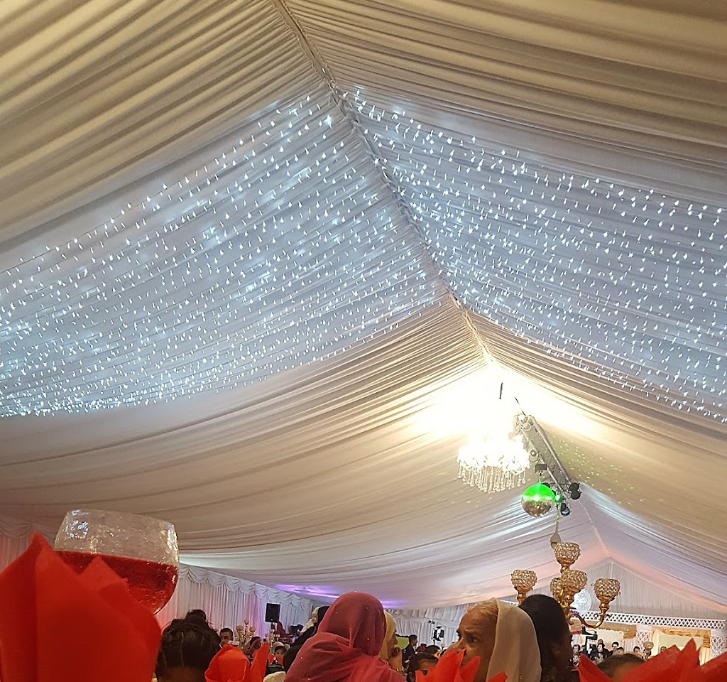 Elegant Banqueting Hall with draped ceiling and fairy lights for weddings and events.