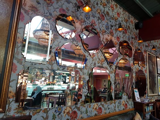 Stylish Sorrento Lounge cafe with decorative mirrors, perfect for events and gatherings.