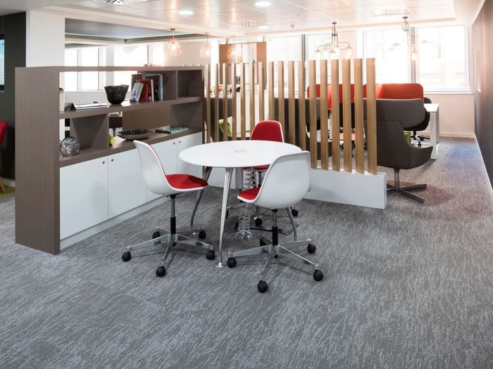 Modern flexible workspace at Regus Birmingham with round table for collaboration.