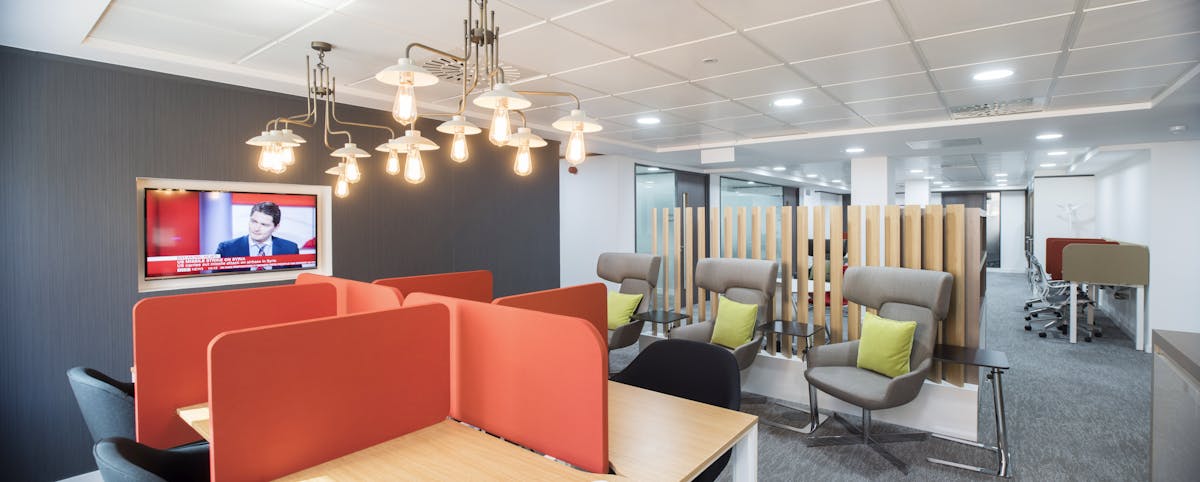 Modern meeting space at Regus Birmingham with semi-private booths for collaboration.