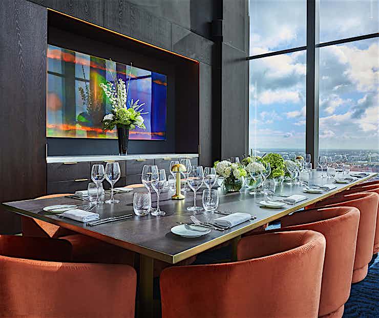Private dining room at Three Church Road with elegant table setup for corporate events.