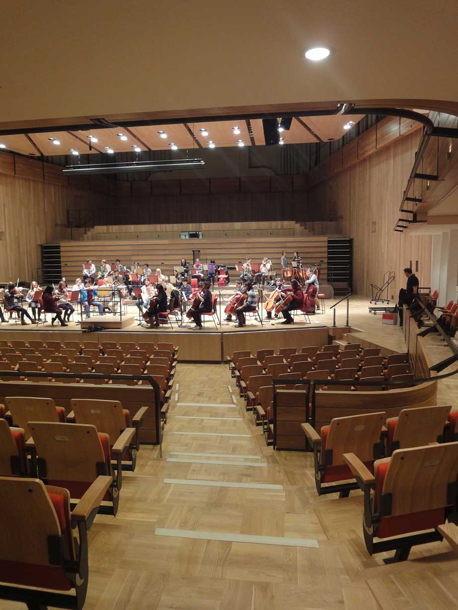 Orchestra setup in Bramall Music Building for concerts and corporate events.