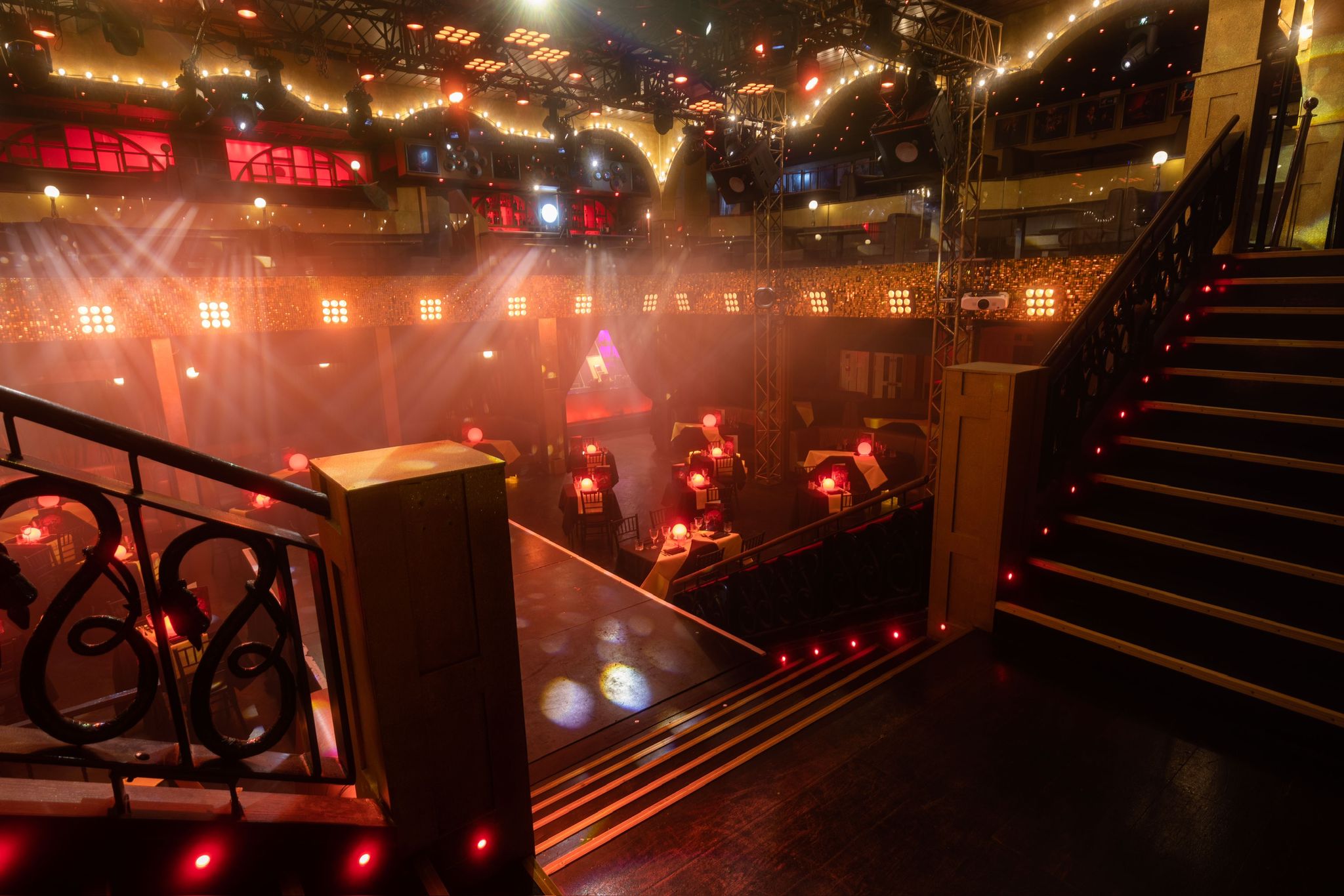 Vibrant event space at Eight Embankment with elegant staircase, ideal for corporate events.