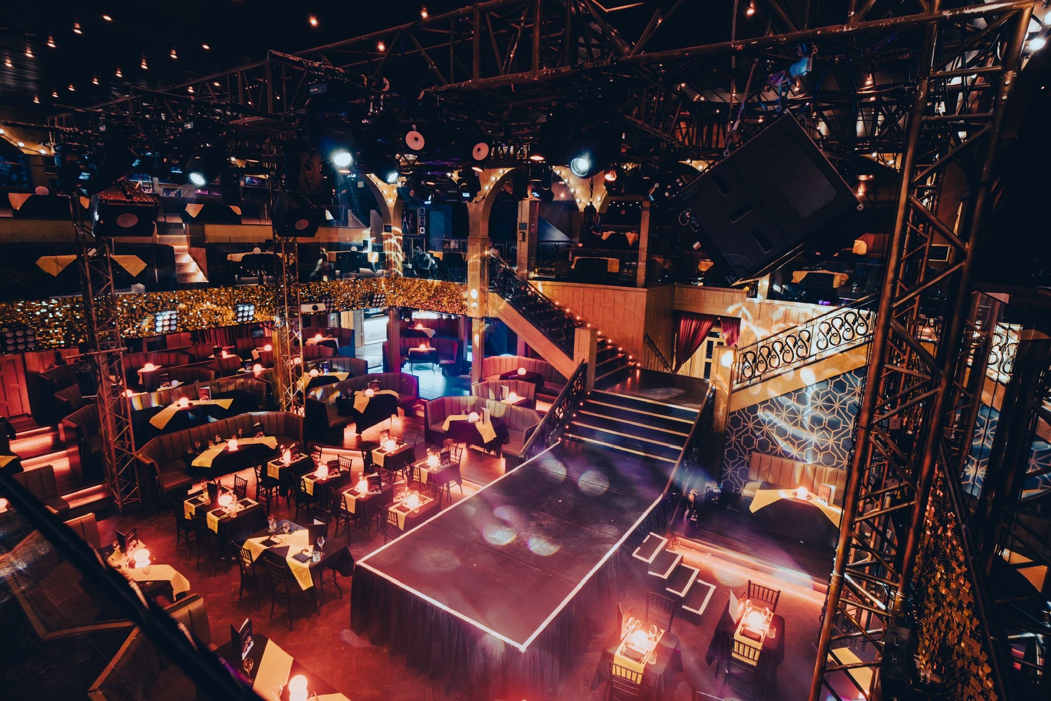 Vibrant event space at Eight Embankment with central stage for corporate gatherings.