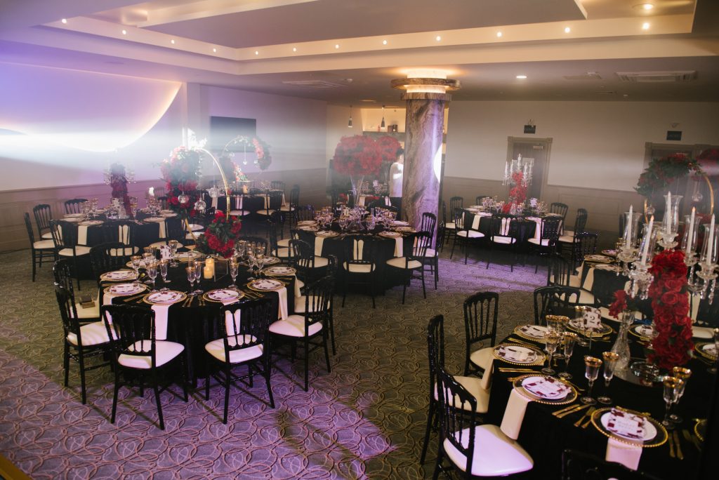 Elegant banquet setup in Prestige Suite with black and white decor for upscale events.