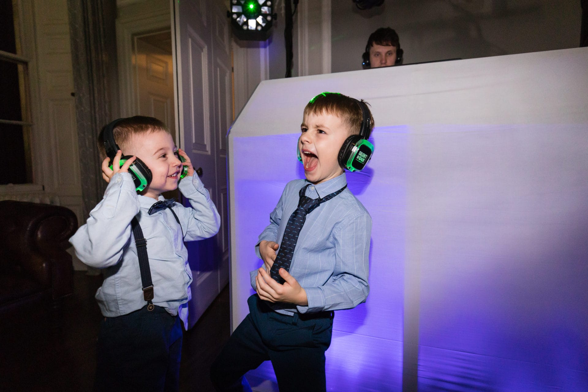 Boys dancing with headphones at a family-friendly Silent Noize event.