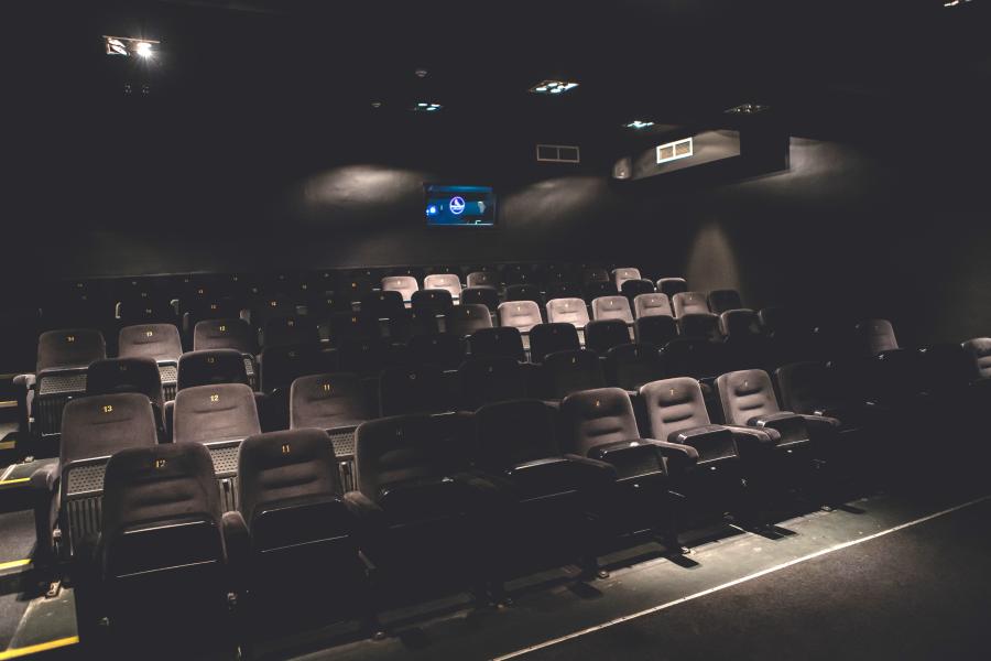Modern screening room with empty seats, ideal for film screenings and presentations.