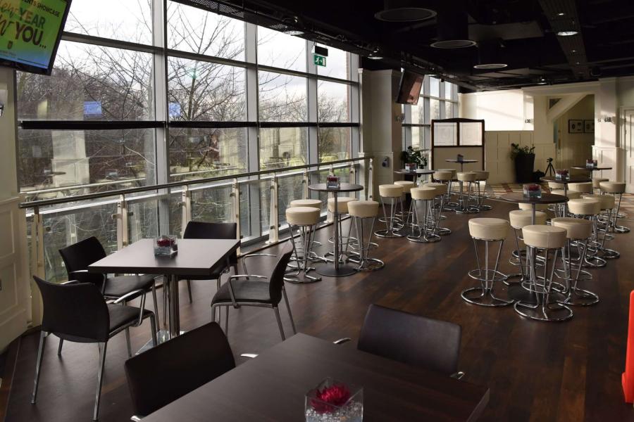 Modern Lounge Bar in Iron House with high-top tables for networking events.