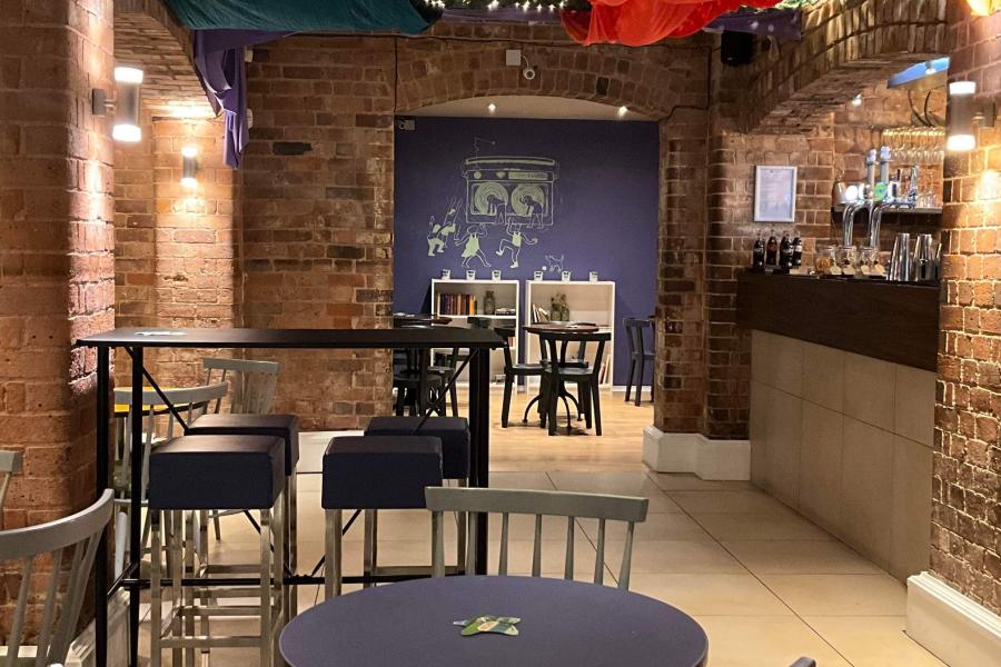 Modern Lounge Bar in Iron House with exposed brick, perfect for events and networking.