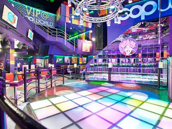Vibrant Popworld Birmingham lounge with colorful dance floor for dynamic events.