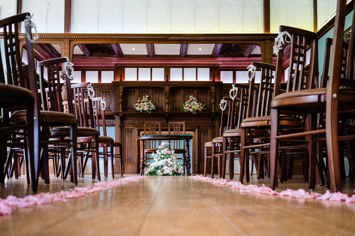 Elegant ceremony space with wooden chairs and floral decor at Pendrell Hall for weddings.