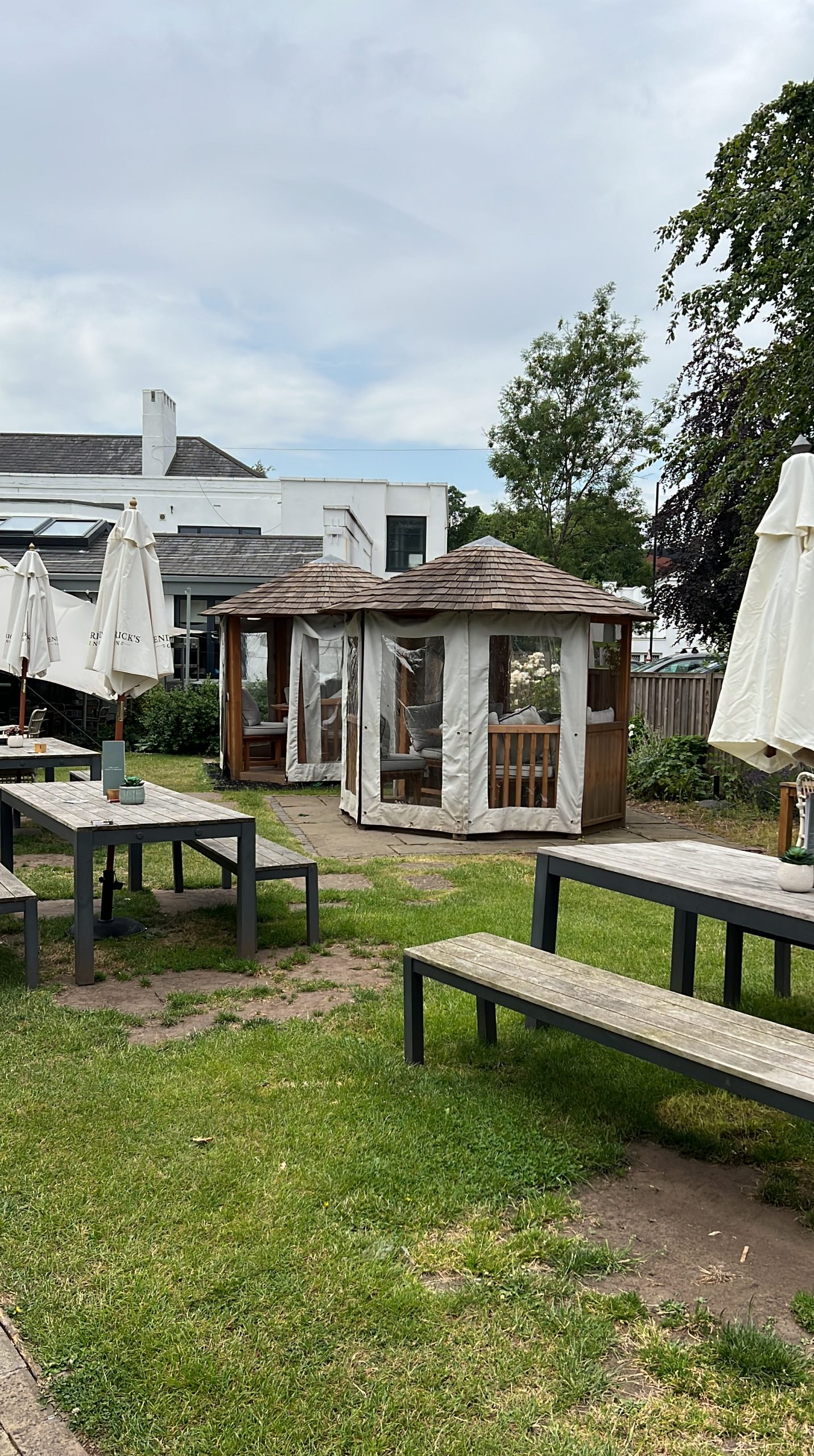 Charming outdoor event space with gazebos, ideal for gatherings and meetings.