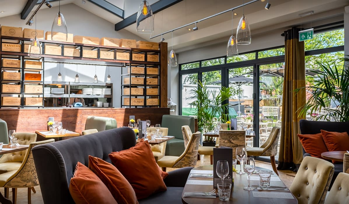 Stylish restaurant bar with modern decor, ideal for networking lunches and events.