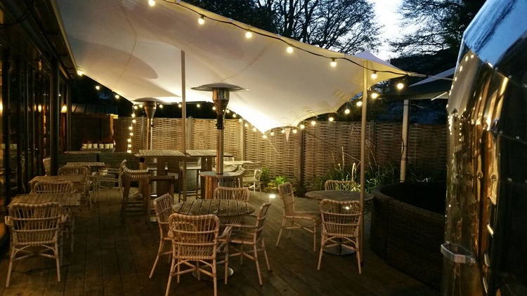 Outdoor event space at The High Field with cozy seating and elegant lighting.