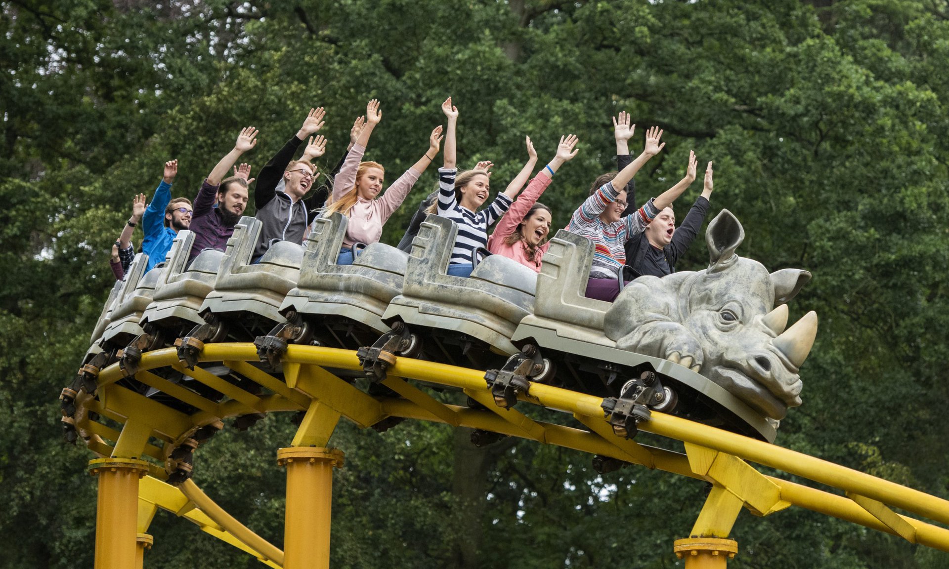 Group enjoying roller coaster at West Midlands Safari Park, perfect for team building events.