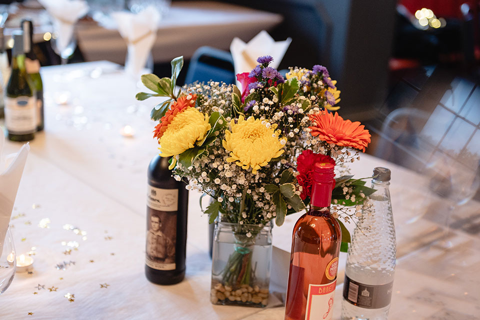 Elegant table centerpiece with flowers at The Court Oak Harborne event space.
